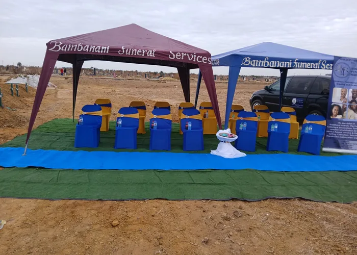 A Bambanani Funeral Services graveside setup with branded gazebos and seating