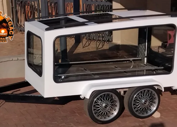 A glass-sided hearse trailer from the Bambanani fleet