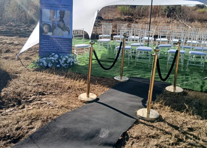 A Bambanani stretch tent and branded banner set up at a graveside