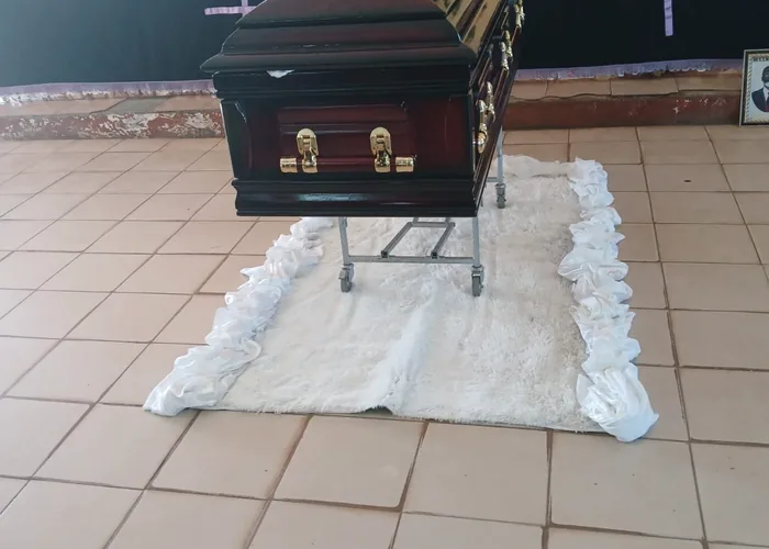A coffin prepared in a chapel before a service